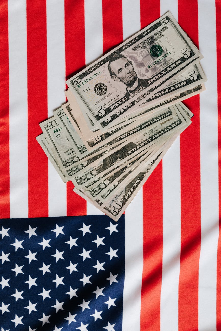 american dollars placed on national flag
